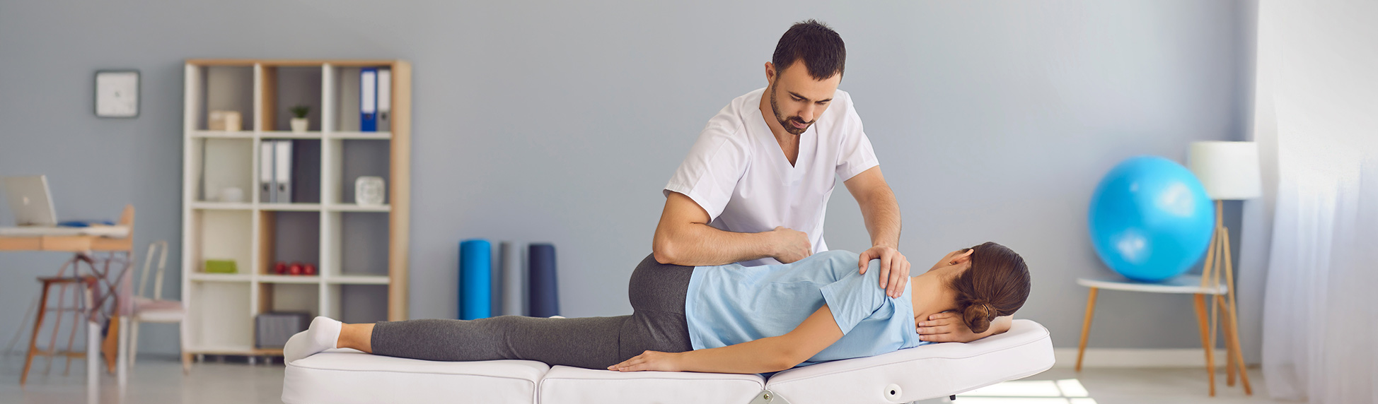 physical therapist working on client