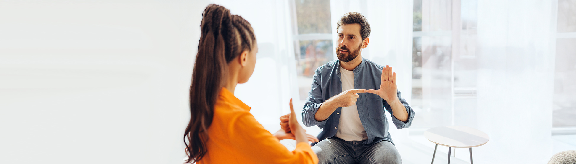Two people speaking sign language